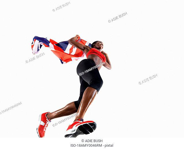 Female athlete running with union jack