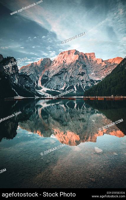 Mountain Lake Reflection at Lago di Braies in summer during sunrise