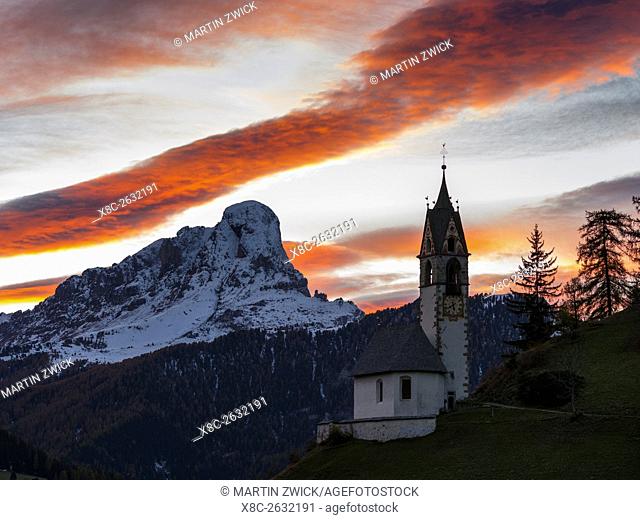 Dawn at chapel Barbarakapelle - Chiesa di santa Barbara in the village of Wengen - La Valle, in the Gader Valley - Alta Badia in the Dolomites of South Tyrol -...