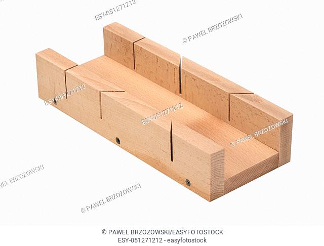 Wooden miter box on white background. Miter box for cutting wood. Woodworking tools for angle cut