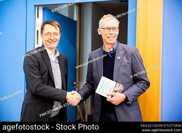 03 November 2022, Berlin: Karl Lauterbach (SPD, l), Federal Minister of Health, and Johan Rockström, Director of the Potsdam Institute for Climate Impact...