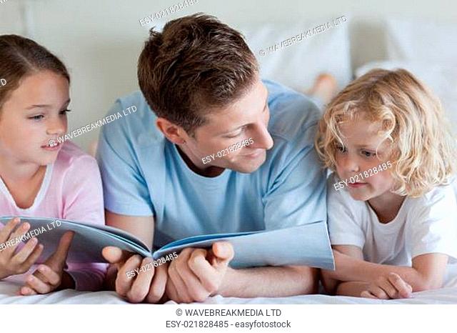 Father reading with his children