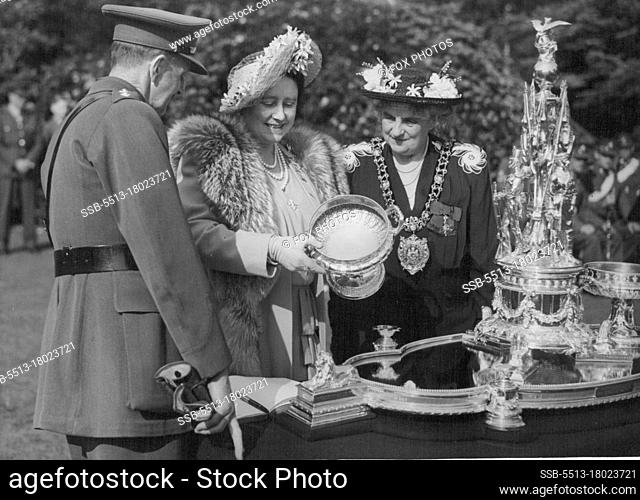 Queen Inspects Manchester Regiment -- The famous old silver centre-piece, made from melted-down battle trophies, which has been in the Regiment's possession...