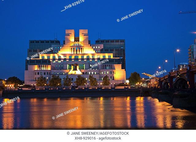 MI6 Building reflecting in Thames River, Vauxhall, London, England, UK