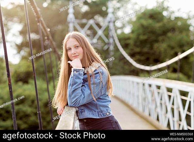 Portrait of teenage girl on a bridge