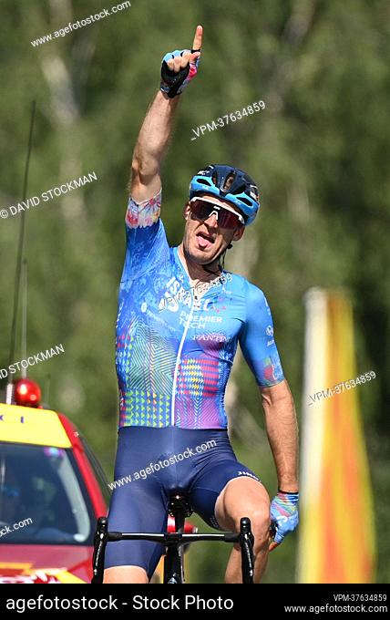 Canadian Hugo Houle of Israel-Premier Tech celebrates as he crosses the finish line to win stage sixteen of the Tour de France cycling race