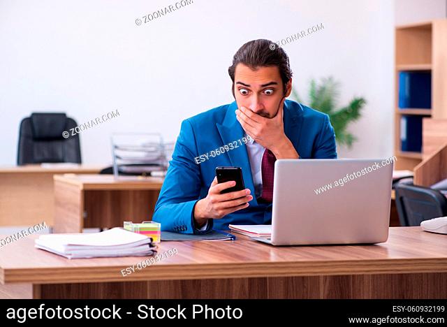 Young businessman employee working at workplace