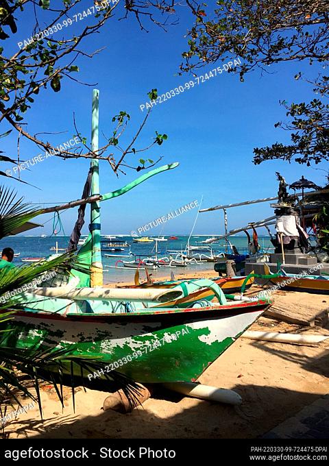15 June 2019, Indonesia, Ubud, Kuta, Sanur: Fishing boats on the beach of Sanur in Bali. Tourists are once again drawn to Southeast Asia