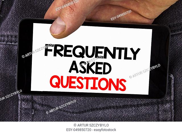 Writing note showing Frequently Asked Questions. Business photo showcasing most common inquiries Informations Help Guide written Mobile Phone Screen holding by...