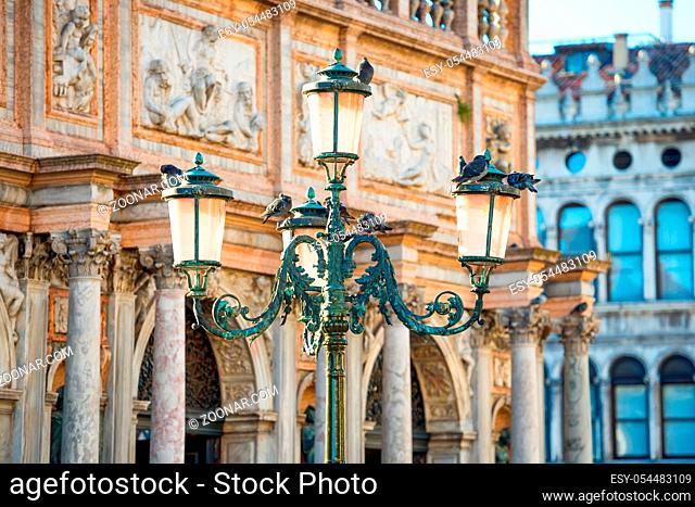Old pink lantern at famous Piazza San Marco in Venice, Italy