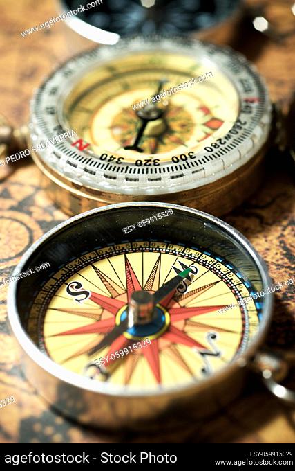 Vintage compass and old navigation map