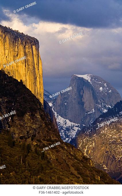 Sunset light on El Capitan and storm clouds over Half Dome and Yosemite Valley, Yosemite National Park, California