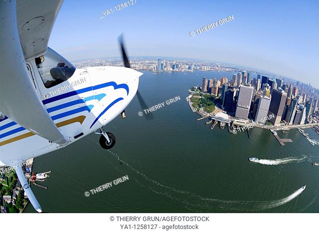 Aerial view from a small plane Cessna 172 flying over Hudson river and Lower Manhattan on thr special VFR uncontrolled airspace, New York City, USA