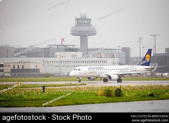 14 July 2021, Lower Saxony, Langenhagen: An airplane of the airline ""Lufthansa"" stands in rainy weather on the area of the airport Hannover-Langenhagen