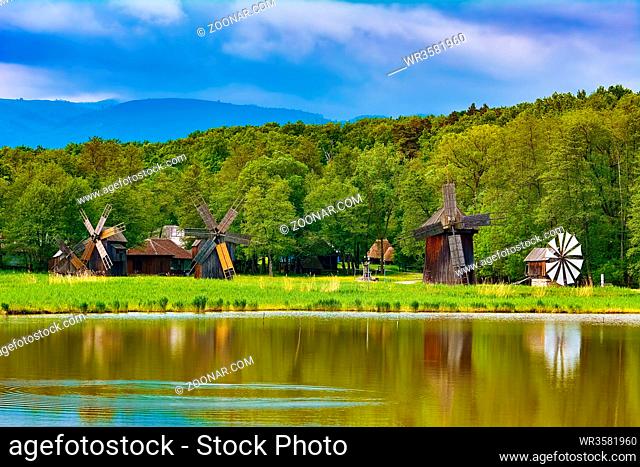 Windmills on the Bank of Lake in Romania