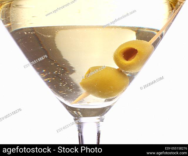 Martini cocktail with olives inside over white background