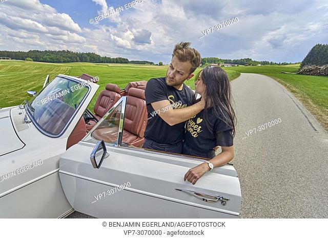 Couple at luxus oldtimer. Turkish ethnicity. High society. Bloggers Adem Bayalan and Emine Feruz Bayalan. Bavaria, Germany