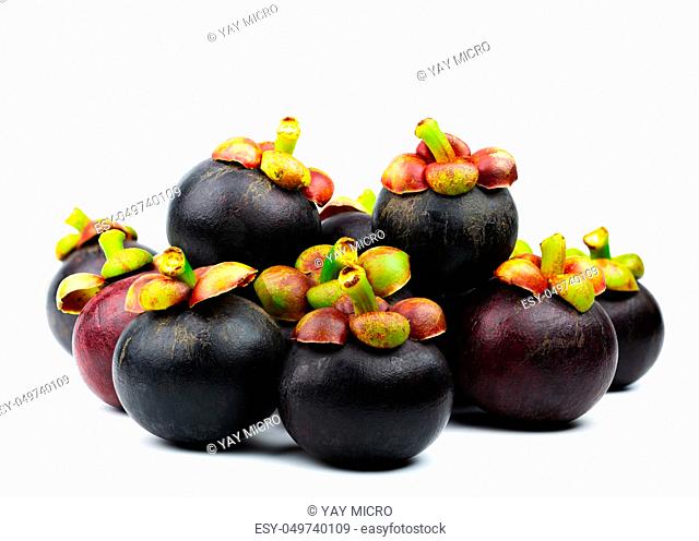 Whole mangosteen showing purple skin isolated on white background with space. Tropical fruit from Thailand. The queen of fruits
