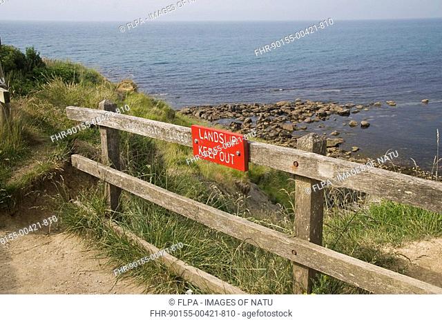 'Landslip, Keep Out' sign, path closed due to coastal cliff erosion, Osmington, Dorset, England, july