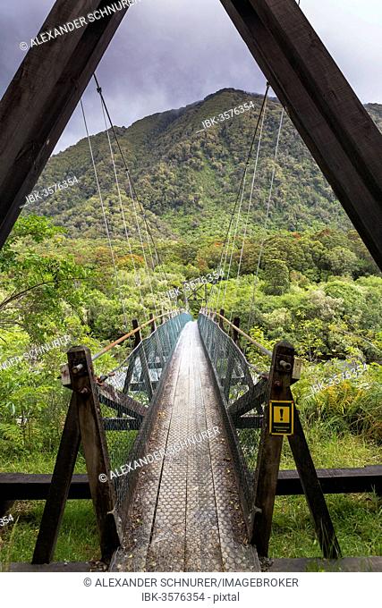 Narrow suspension bridge over the Fox River, Fox River, West Coast Region, New Zealand