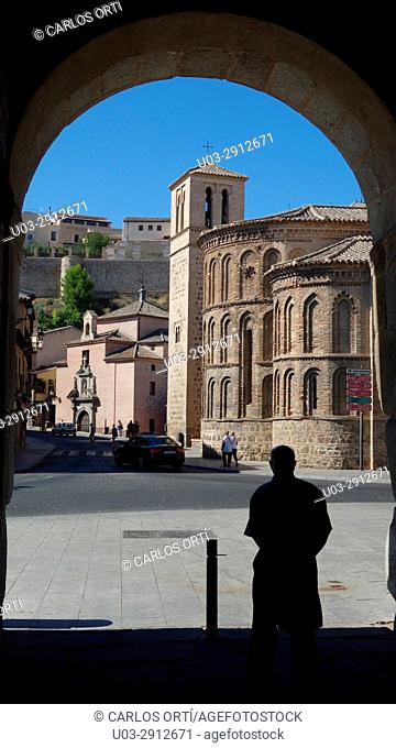 Tourist near the Church of Santiago del Arrabal, a small temple in the outskirts of the spanish town of Toledo, Spain, Europe