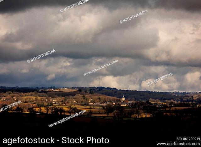 Panorama of landscape with town and clouds