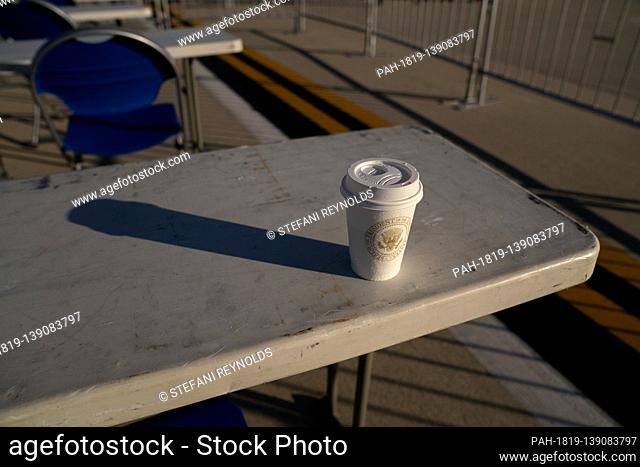 A cup with the Presidential seal on it is left behind following a farewell ceremony at Joint Base Andrews, Maryland, U.S., on Wednesday, Jan. 20, 2021
