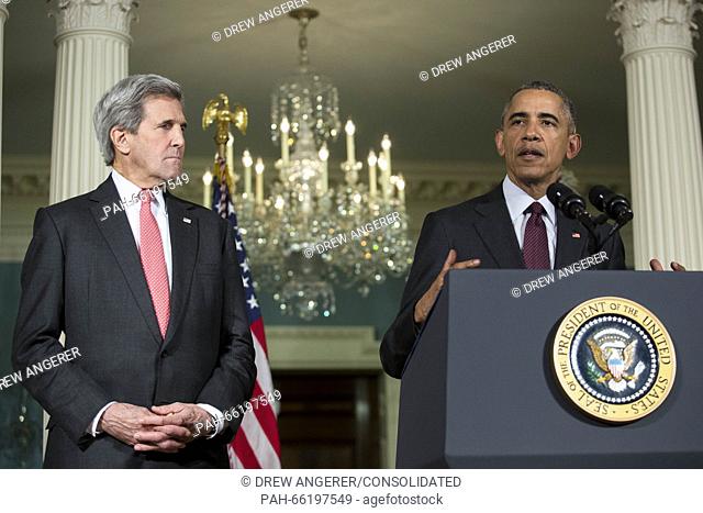 United States Secretary of State John Kerry , left, looks on as US President Barack Obama, right, makes a statement after meeting with his National Security...