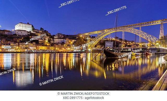 View from Vila Nova de Gaia towards Porto with the old town, the bridge Ponte Dom Luis I and the traditional Rabelo boats, used to ship wine