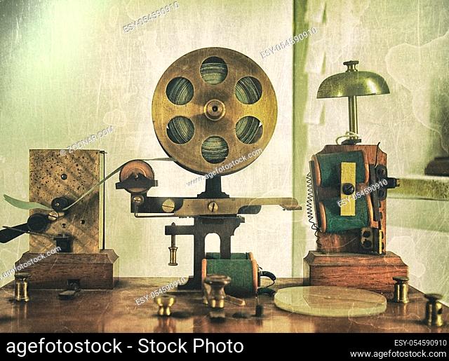 vintage effect image of an old morse code telegraph machine with bell and brass printer