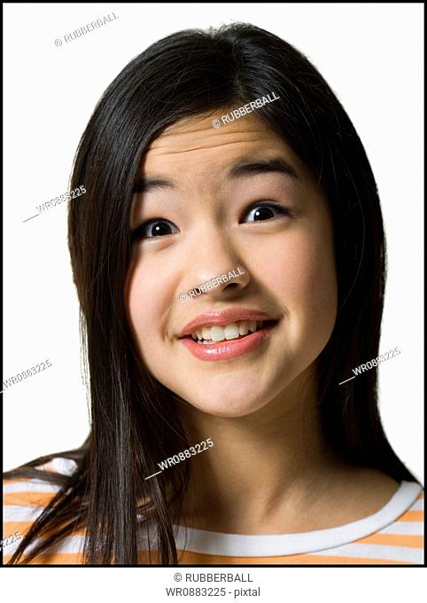 Portrait of a teenage girl looking surprised