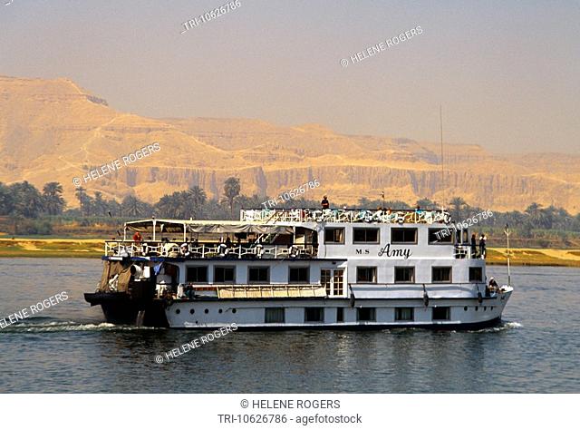 Nile Egypt Cruise Boat Between Dandera And Luxor Sandstone Cliffs In The Distance