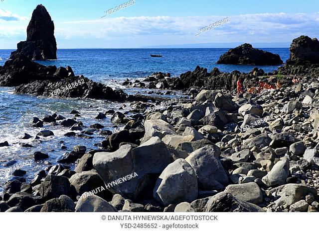 Europe, Italy, Sicily, Catania, Aci Castello, Aci Trezza, black beach from Etna volcano lava near Cyclopean rock