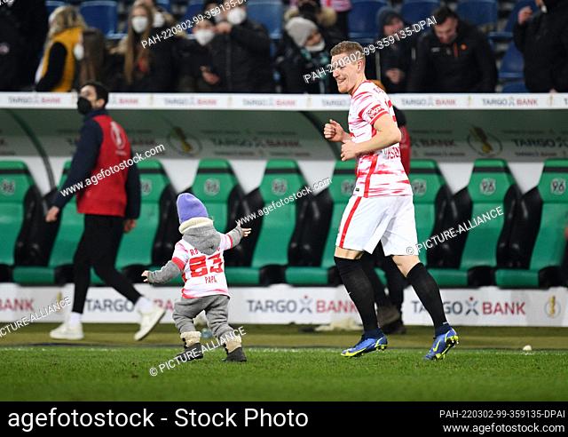 02 March 2022, Lower Saxony, Hanover: Soccer: DFB Cup, quarterfinals: Hannover 96 - RB Leipzig at the HDI Arena. Leipzig's Marcel Halstenberg walks across the...