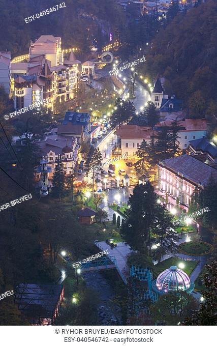 Borjomi, Samtskhe-Javakheti, Georgia. Aerial View Borjomi Cityscape, Hotel House And Central Park In Autumn October Evening Night In Night Illuminations Lights...