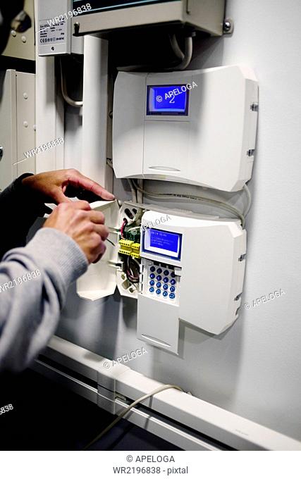 Electrician repairing access control system