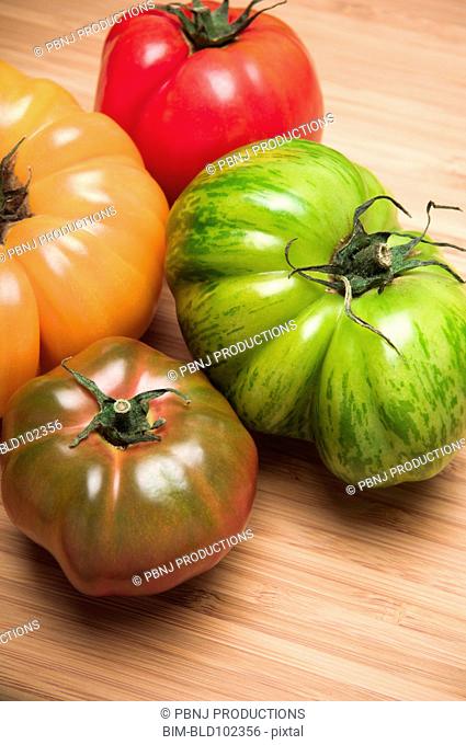 Four colorful tomatoes