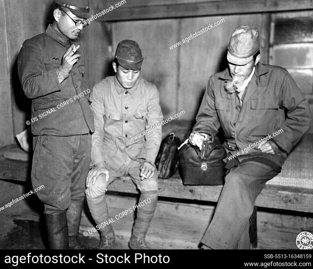 War Criminal -- Dr. Hisakichi Tokuda, allegedly responsible for medical experimentation on American POWs, shown talking with two Jap soldiers