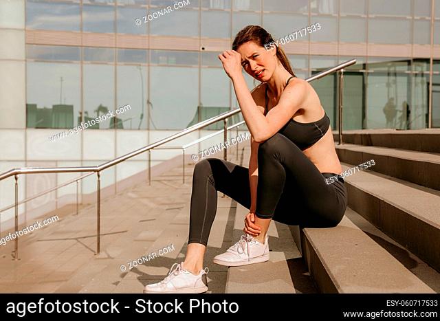 A woman standing in front of a building. High quality photo