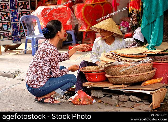 Female street vendor selling various thingsl, Dong Da District, Hanoi, Vietnam