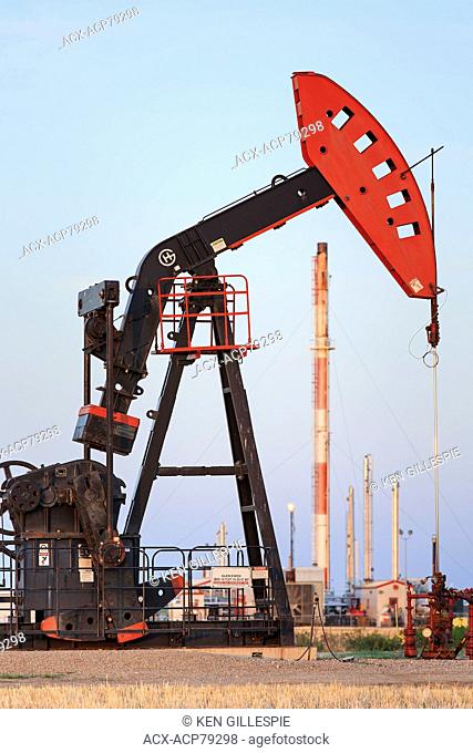 Oil pump jack and natural gas plant, Bakken Oil field, near Glen Ewen, Saskatchewan, Canada