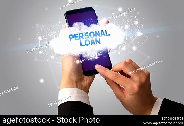 Female hand touching smartphone with PERSONAL LOAN inscription, cloud business concept