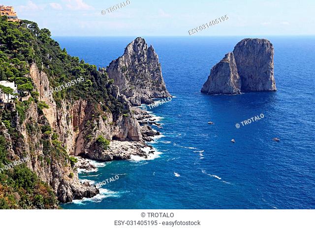 Gorgeous landscape of famous faraglioni rocks on Capri island, Italy. Capri is located on Tyrrhenian sea. It has been a resort since the time of Roman Republic