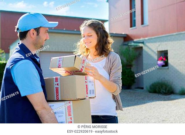 Young attractive woman checking her parcel