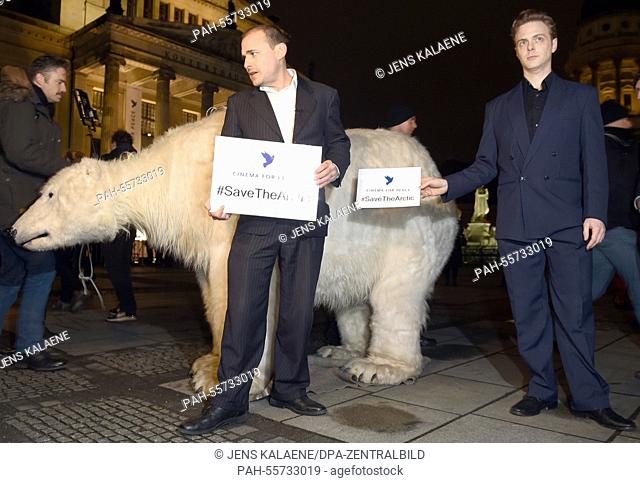 Activists demonstrate with a 'polar bear' with the slogan '#SaveTheArctic' before the Cinema for Peace Gala in Berlin,  Germany, 09 February 2015