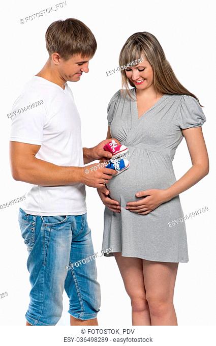 Portrait of a happy young pregnant woman with her husband