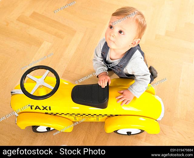 Baby with Toy Taxi