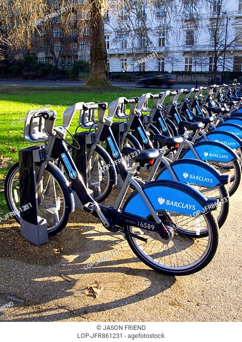 Rows of bikes at Barclays cycle hire docking station in Hyde Park