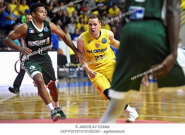 Radovan Kouril of Opava, center, and Dominic Waters of Nanterre, left, in action during the Men's Basketball Champions League group B first round game Opava vs...