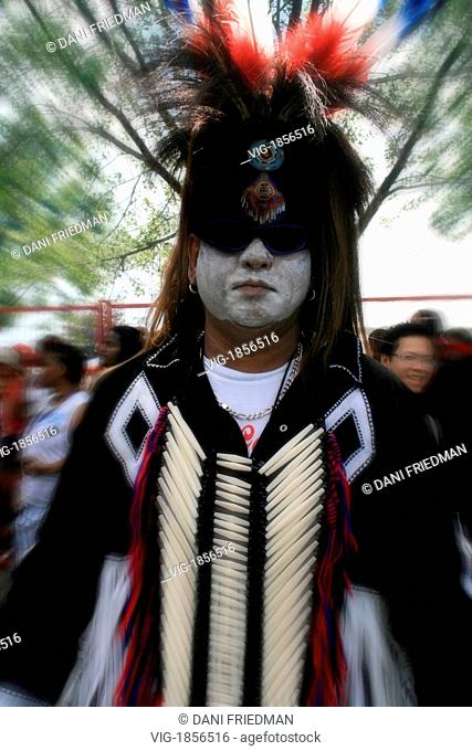 CANADA, TORONTO, 08.02.2009, A performer dressed in Native Indian clothing at a summer outdoor festival. - TORONTO, ONTARIO, CANADA, 08/02/2009